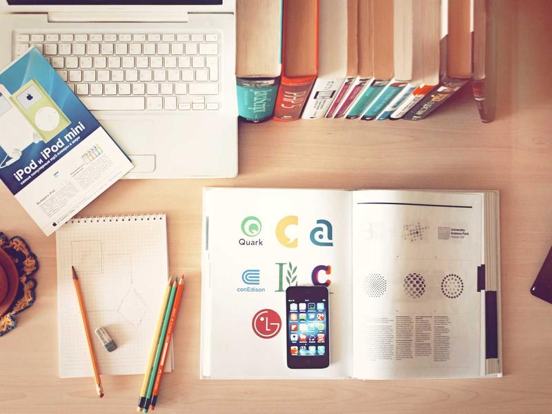 A busy open office space highlighting sound levels and worker concentration with headphones.