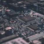 Macro electronics circuit board featuring precision SMD capacitors, resistors, and micro filtering networks for audio crossover systems