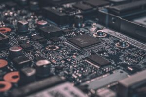 Macro electronics circuit board featuring precision SMD capacitors, resistors, and micro filtering networks for audio crossover systems